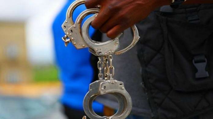 A Nigerian police officer holds a bunch of handcuffs in Abuja on October 3, 2020. Sodiq Adelakun-Channels TV