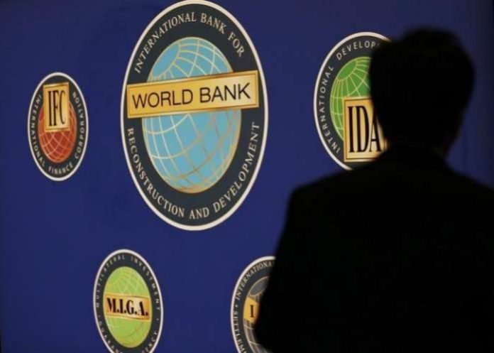 A man is silhouetted against the logo of the World Bank at the main venue for the International Monetary Fund (IMF) and World Bank annual meeting in Tokyo. REUTERS-Kim Kyung-Hoon A man is silhouetted against the logo of the World Bank at the main venue for the International Monetary Fund (IMF) and World Bank annual meeting in Tokyo. REUTERS-Kim Kyung-Hoon