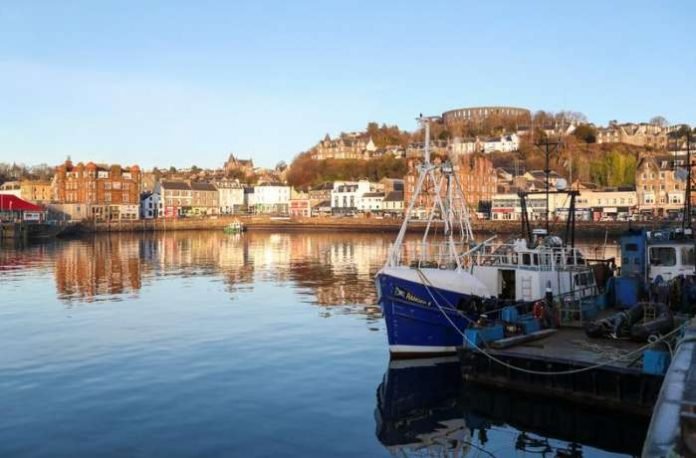 FILE PHOTO - A fishing boat is seen at Oban harbor in Scotland, January 8, 2021. REUTERS-Russell Cheyne-File Photo