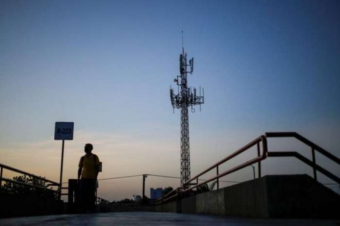 FILE PHOTO - A man walks by near a cellular tower in the municipality of Guadalupe, Mexico July 6, 2020. REUTERS-Daniel Becerril FILE PHOTO - A man walks by near a cellular tower in the municipality of Guadalupe, Mexico July 6, 2020. REUTERS-Daniel Becerril