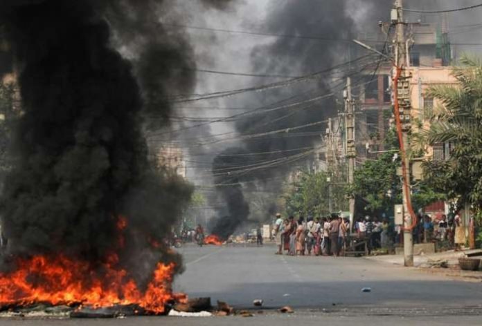 Tires burn on a street as protests against the military coup continue, in Mandalay, Myanmar March 27, 2021. REUTERS-Stringer Tires burn on a street as protests against the military coup continue, in Mandalay, Myanmar March 27, 2021. REUTERS-Stringer