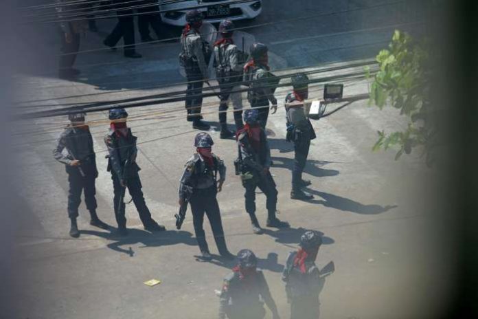 FILE PHOTO- Police stand after they seized Sanchaung district in search of anti-coup demonstrators in Yangon, Myanmar, March 8, 2021. REUTERS-Stringer FILE PHOTO- Police stand after they seized Sanchaung district in search of anti-coup demonstrators in Yangon, Myanmar, March 8, 2021. REUTERS-Stringer