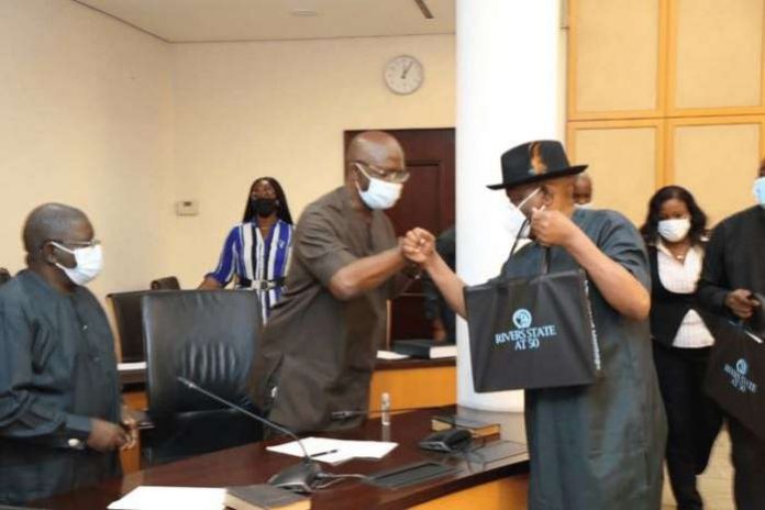 Governor of Rivers State Nyesom Ezenwo Wike (right) presents a souvenir to the Chairman of the House of Representatives Committee on Petroleum Industry Bill, Hon. Victor Nwokolo Onyemaechi who led the committee on courtesy visit to Government House, Port Harcourt on Thursday Governor of Rivers State Nyesom Ezenwo Wike (right) presents a souvenir to the Chairman of the House of Representatives Committee on Petroleum Industry Bill, Hon. Victor Nwokolo Onyemaechi who led the committee on courtesy visit to Government House, Port Harcourt on Thursday