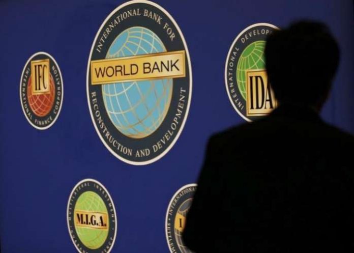 A man is silhouetted against the logo of the World Bank at the main venue for the International Monetary Fund (IMF) and World Bank annual meeting in Tokyo. REUTERS-Kim Kyung-Hoon A man is silhouetted against the logo of the World Bank at the main venue for the International Monetary Fund (IMF) and World Bank annual meeting in Tokyo. REUTERS-Kim Kyung-Hoon
