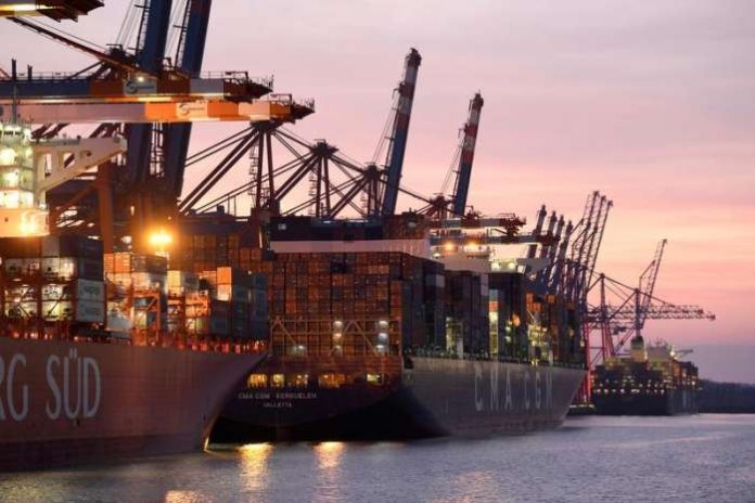 FILE PHOTO - Container ships are loaded at a container terminal in the harbor amid the outbreak of coronavirus disease (COVID-19) in Hamburg, Germany, March 29, 2021. REUTERS-Fabian Bimmer-File Photo FILE PHOTO - Container ships are loaded at a container terminal in the harbor amid the outbreak of coronavirus disease (COVID-19) in Hamburg, Germany, March 29, 2021. REUTERS-Fabian Bimmer-File Photo