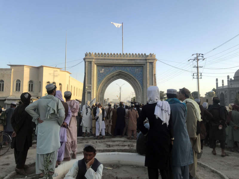 Taliban militants raise their flag as they gather a day after taking control of Kandahar, Afghanistan, 14 August 2021. Afghan President Ashraf Ghani on 14 August said that the 'top priority' is to remobilize troops to counter the Taliban offensive, as the Islamist group seized control of a 20th provincial capital in a little over a week. EPA-EFE/STRINGER