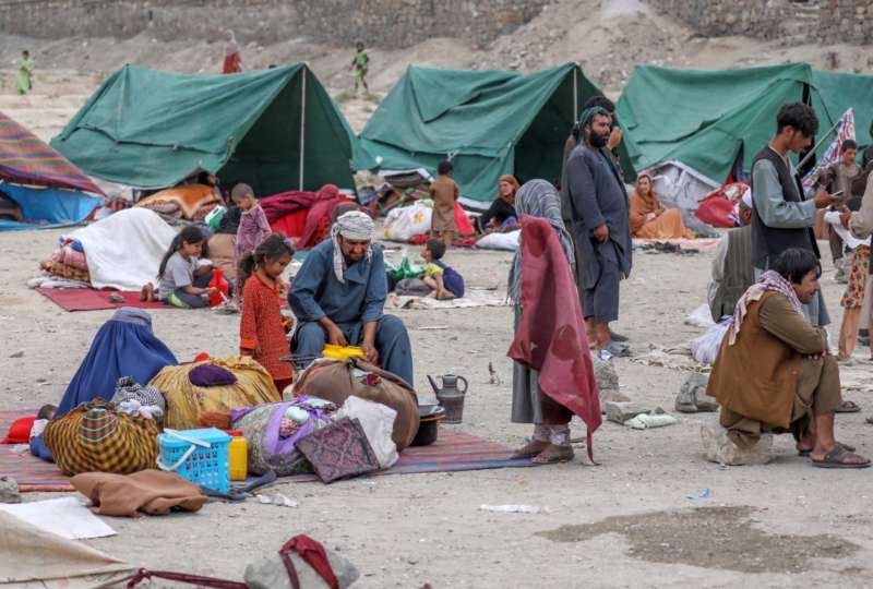 Internally displaced families from northern provinces, who fled from their homes due to the fighting between Taliban and Afghan security forces, take shelter in a public park in Kabul, Afghanistan, 14 August (issued 15 August). The Taliban captured Mazar-i-Sharif, the country's fourth-largest city and the government's last major stronghold in the north on 14 August, as they tightened their grip on the country and closed in on Kabul. Most of the remote districts of the provinces have already fallen to the Taliban in the past three months. EPA-EFE/HEDAYATULLAH AMID