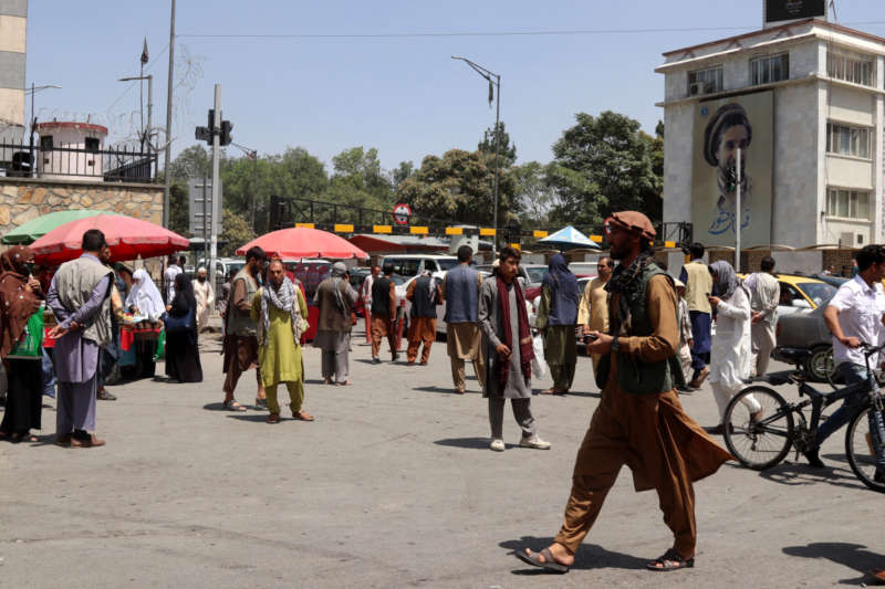 Afghans who work at different offices rush to homes after news broke that Taliban reached on the outskirts of Kabul, in Kabul, Afghanistan, 15 August 2021. The Taliban have reached the outskirts of Kabul, the capital city of Afghanistan, where the Afghan government reported there have been shots heard, although the insurgents said they will not enter the city by force and are negotiating a peaceful transition of power. EPA-EFE/STRINGER