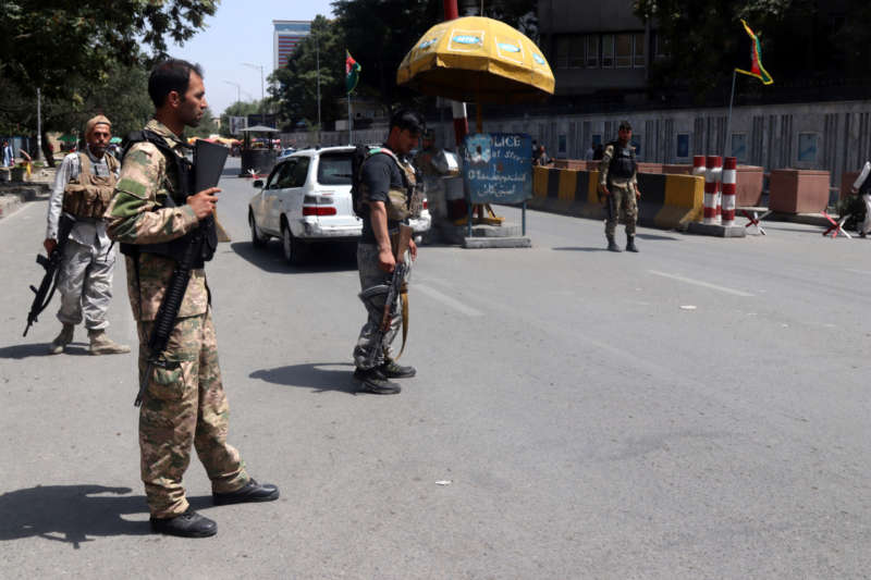 Afghan security officials stand guard at a checkpoint in Kabul, Afghanistan, 15 August 2021. The Taliban have reached the outskirts of Kabul, the capital city of Afghanistan, where the Afghan government reported there have been shots heard, although the insurgents said they will not enter the city by force and are negotiating a peaceful transition of power. EPA-EFE/STRINGER