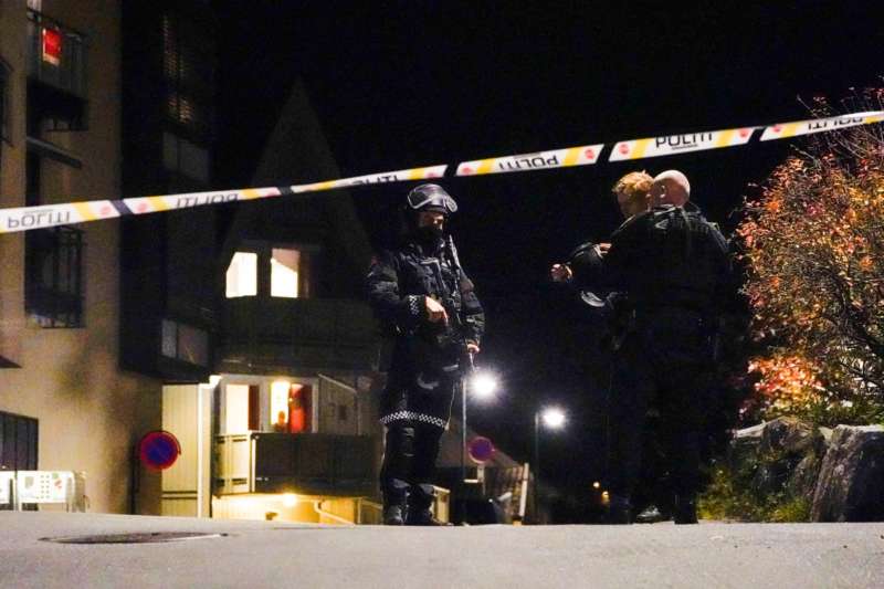 Police officers investigate after several people were killed and others were injured by a man using a bow and arrows to carry out attacks, in Kongsberg, Norway, October 13, 2021. Hakon Mosvold-NTB-via REUTERS