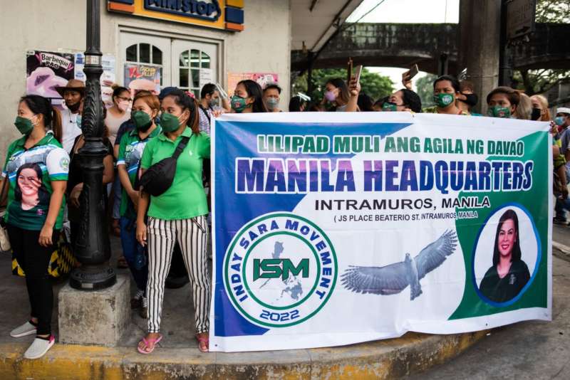 Supporters of Davao City Mayor Sara Duterte gather outside the Commission on Elections, after representatives filed her certificate of candidacy for vice president for the 2022 national election, in Manila, Philippines, November 13, 2021. REUTERS